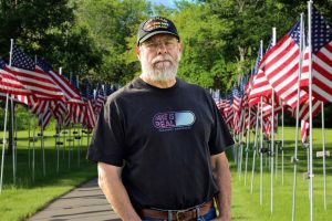 Veteran wearing a Fake Is Real shirt